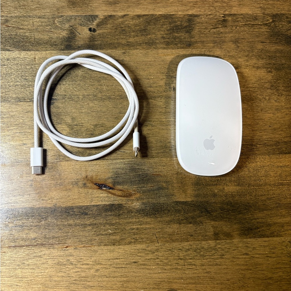 Apple wireless mouse lighting port, with charger.